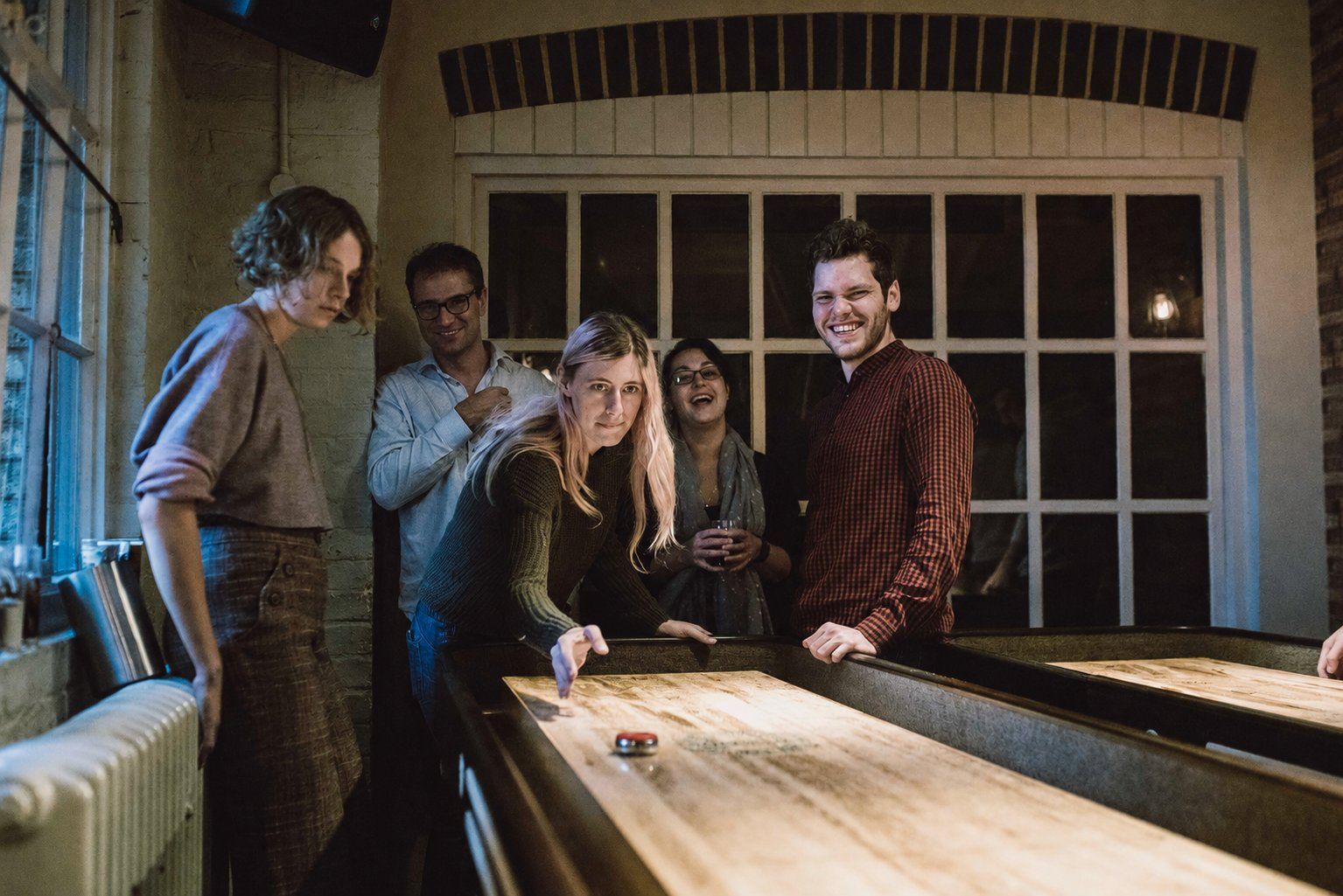 Group playing shuffleboard